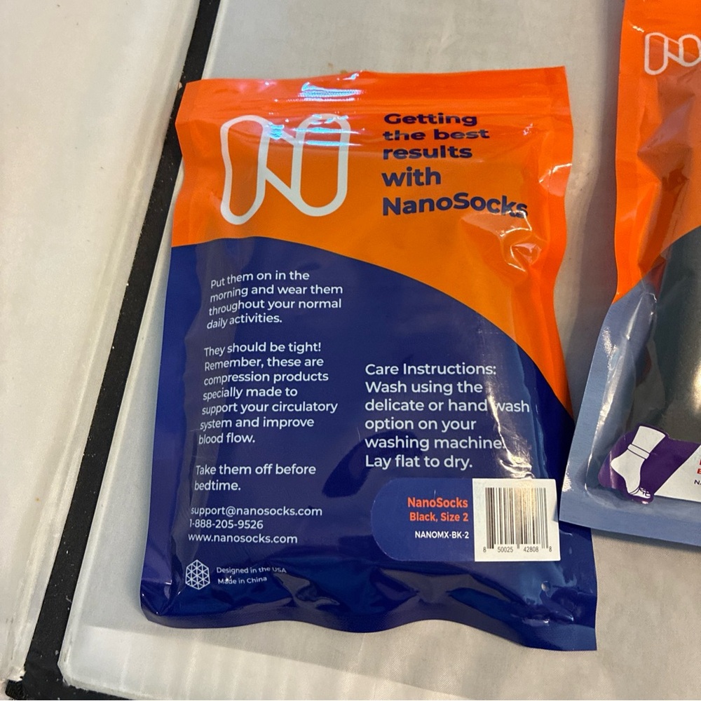 Nano 3D Nanosocks in Black and Orange Packaging - Picture 3 of 4